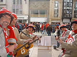 Boycezone singing on the streets of Cardiff before the Wales - France Grand Slam rugby international, collecting for Touch Trust.