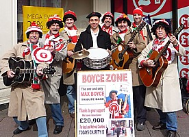 Click for full size picture of Boycezone singing on the streets of Cardiff before the Wales - France Grand Slam rugby international 2012, collecting for Touch Trust.