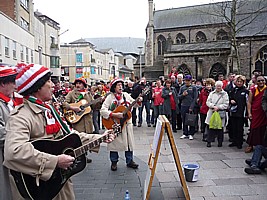 Click for full size picture of Boycezone singing on the streets of Cardiff before the Wales - France Grand Slam rugby international 2012, collecting for Touch Trust.