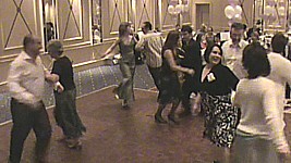 Dancing Ffaniglen at a wedding ceilidh in the Angel Hotel, Cardiff.